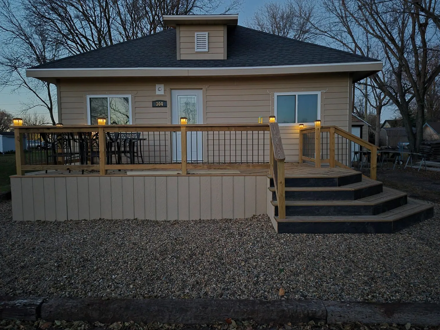Front deck with railing and steps on a home