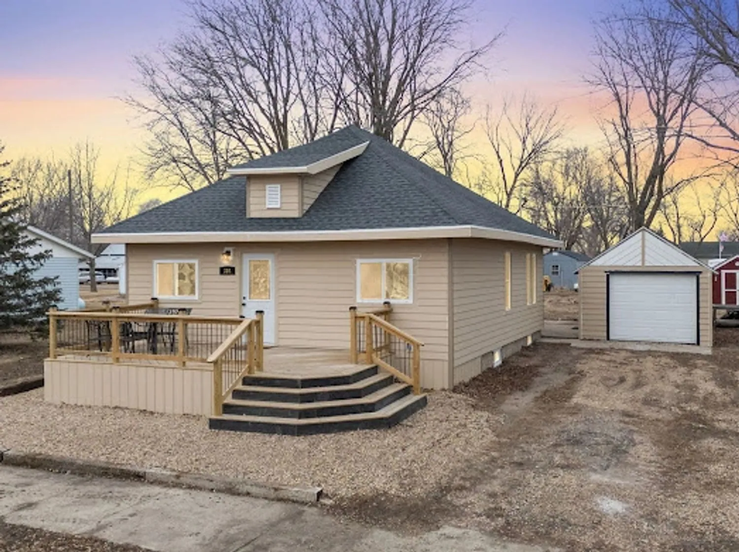 Home with a new wraparound deck and stairs near Sioux Falls