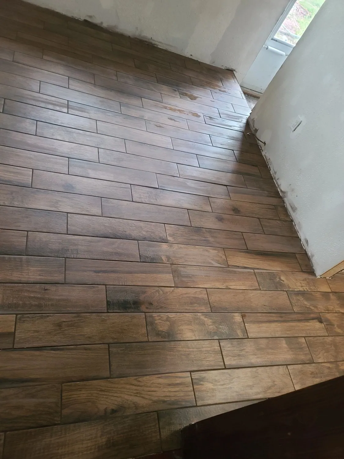 Wood-look tile flooring installed in a hallway