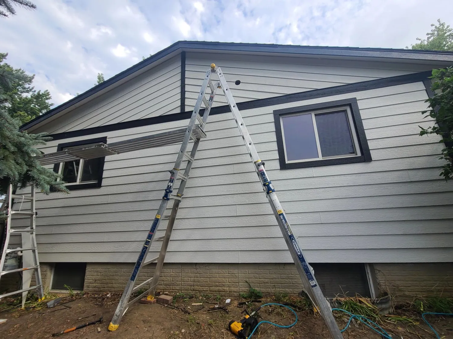 Siding installation in progress on a home